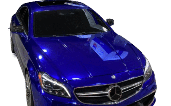 Reflective blue chrome vinyl covering on a luxury sedan parked